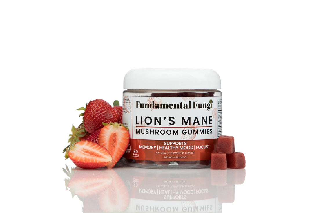 Lion's Mane mushroom gummies bottle with fresh strawberries